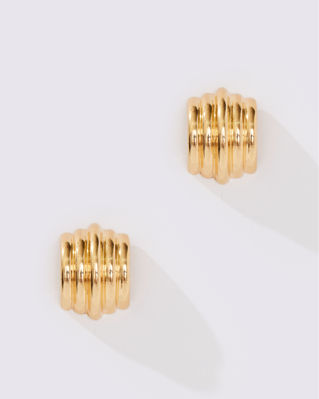 CURVED STATEMENT EARRING