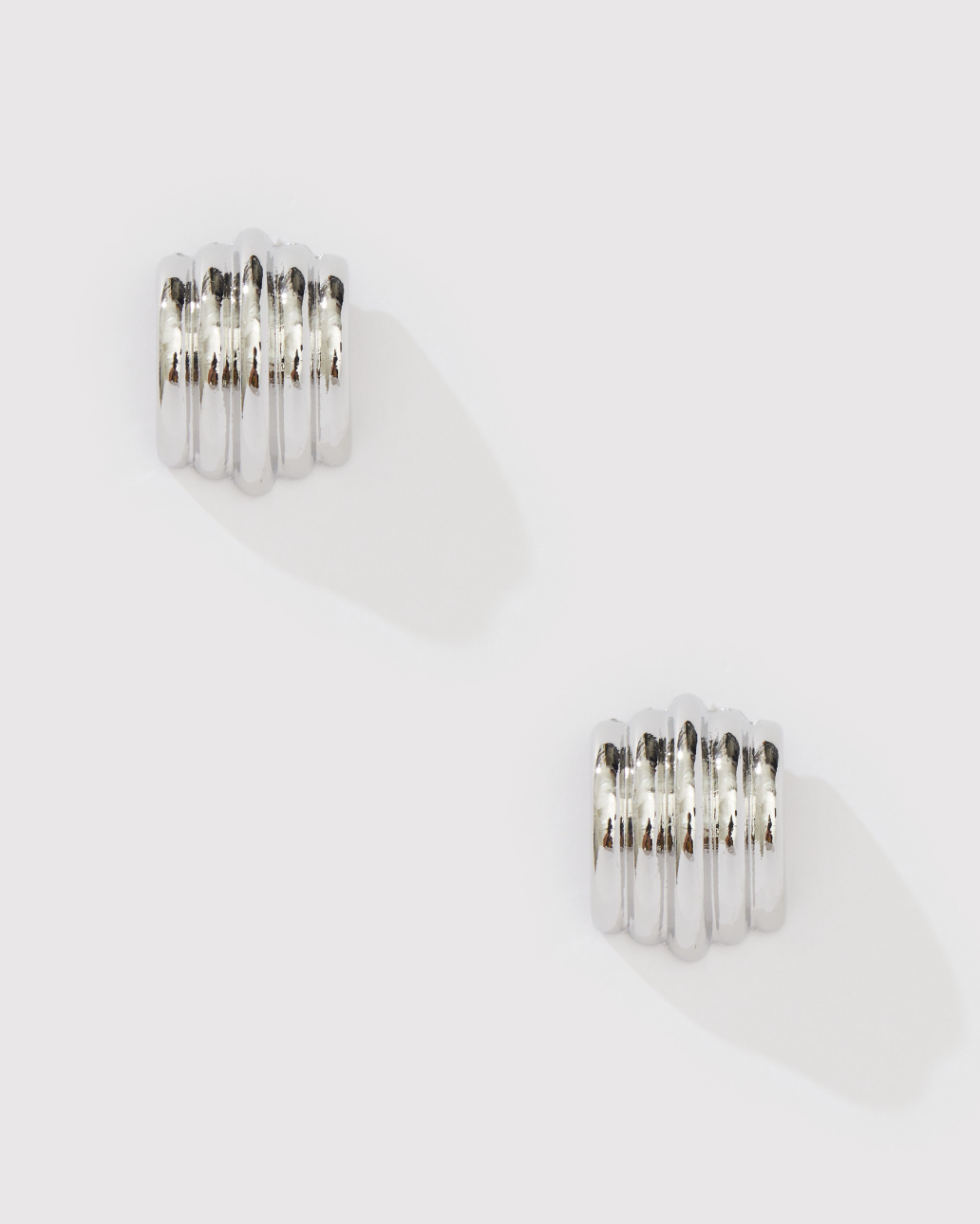 CURVED STATEMENT EARRING
