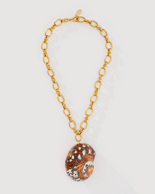 Merielle gold statement necklace with a large shell pendant