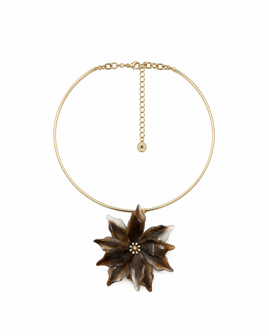 Tremiti choker, a slim gold collar with an oversized brown and cream marbled acrylic flower pendant and a rhinestone center