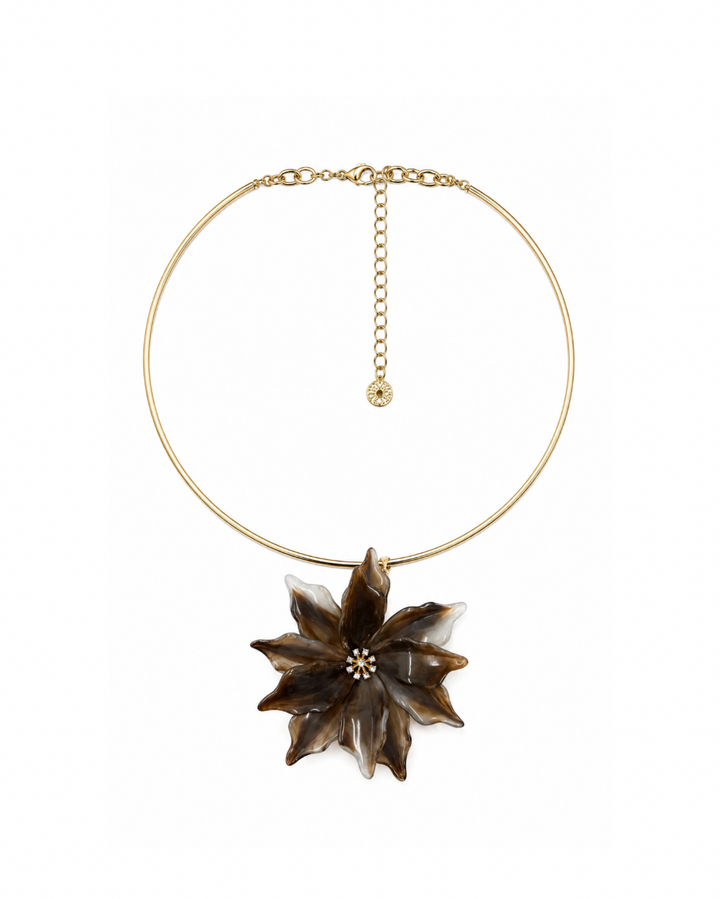 Tremiti choker, a slim gold collar with an oversized brown and cream marbled acrylic flower pendant and a rhinestone center